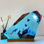 Whale Shark Resin Night Light by xaudis illuminating a cozy room