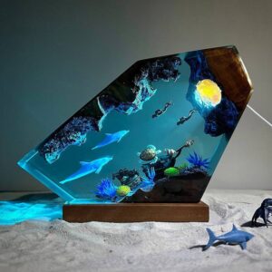 Dolphin and Turtle Resin Night Light by xaudis emitting a soft glow